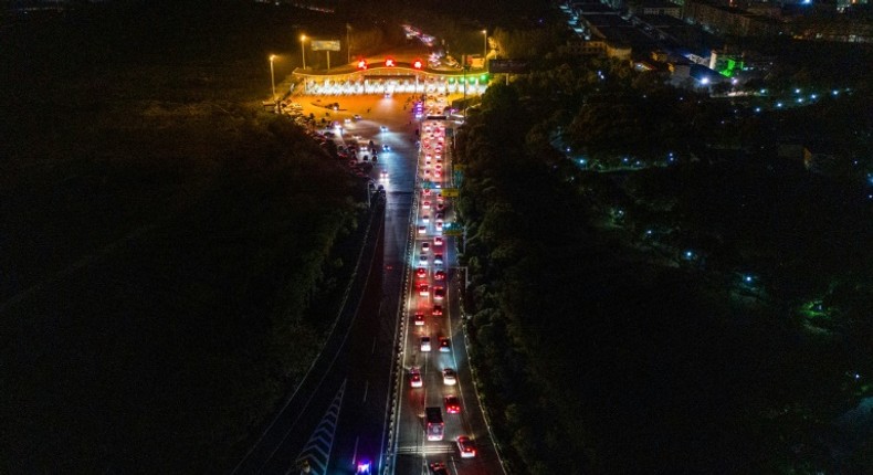 Cars queueing at a highway toll station in Wuhan in China's central Hubei province, as they prepare to leave the city after authorities lifted a more than two-month ban on outbound travel