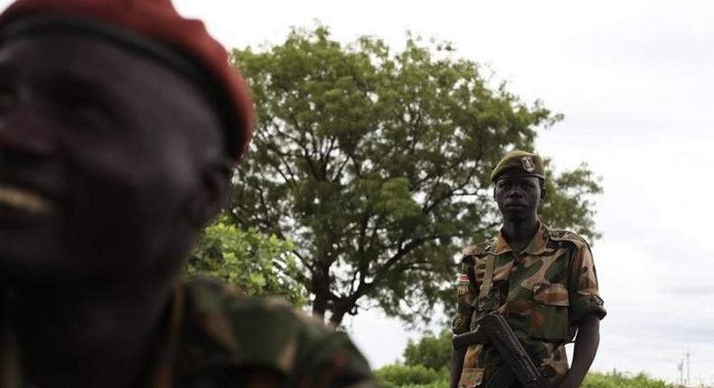 Sudan People's Liberation Army (SPLA) soldiers chat before the start of celebrations on the 31st anniversary of the SPLA in Juba May 16, 2014. REUTERS/Andreea Campeanu