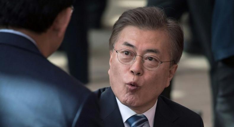 South Korea presidential candidate Moon Jae-In attends a prayer session marking Buddha's birthday on May 3, 2017