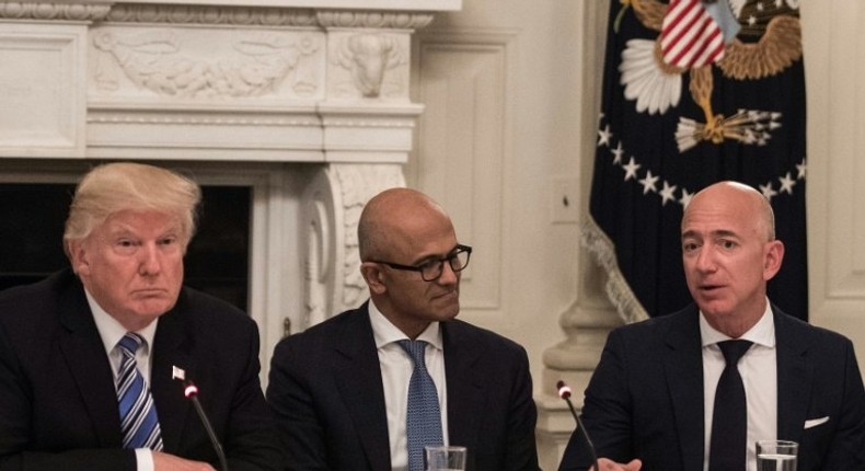 US President Donald Trump, pictured with Microsoft CEO Satya Nadella and Amazon CEO Jeff Bezos business roundtable at the White House on June 19, has renewed his criticism of Amazon, claiming the online giant is harming other retailers