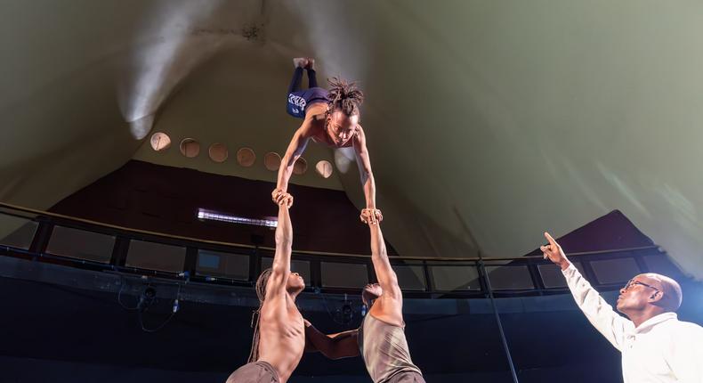 Watchful eyes of Acrobat Coach, Mr Mathias Kavita, as his team dazzles with their breathtaking skills.