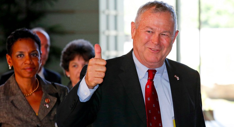 U.S. Representative Dana Rohrabacher (R-Ca) gestures as his U.S. Congressional delegation arrives to meet Japanese Prime Minister Shinzo Abe at the Prime Minister's official residence in Tokyo September 2, 2013.