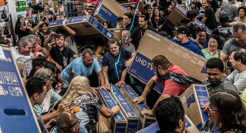 Shoppers fight for TVs on Black Friday.
