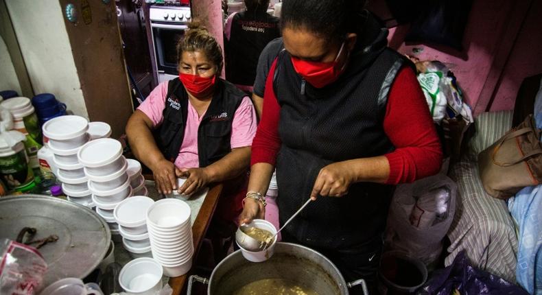 Lidia Portales, center, is helping feed sex workers deprived of their livelihoods by Peru's lockdown imposed over the coronavirus pandemic