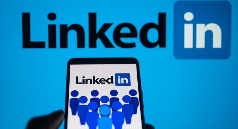 LinkedIn logo displayed on a smartphone with LinkedIn on screen seen in the background, in this photo illustration. On 16 October 2023, in Brussels, Belgium.Jonathan Raa/NurPhoto via Getty Images