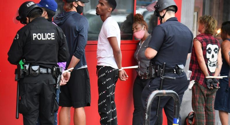 People are arrested in Hollywood, California on June 1, 2020 as police impose a curfew