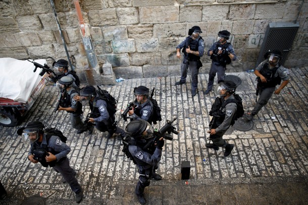 Israeli policemen guard a street at Jerusalem's Old city outside the compound known to Muslims as No