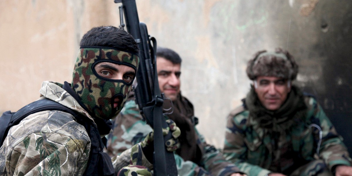 Kurdish Peshmerga fighters take a rest on the outskirts of Mosul January 30, 2015.