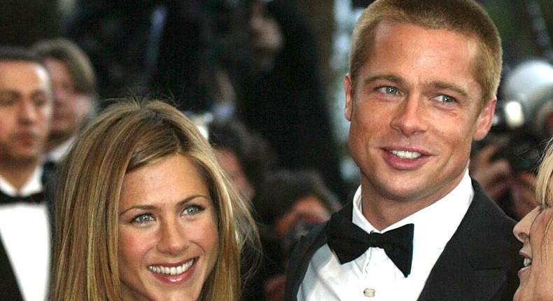 Brad Pitt, right, and his wife Jennifer Aniston arrive for the screening of the film