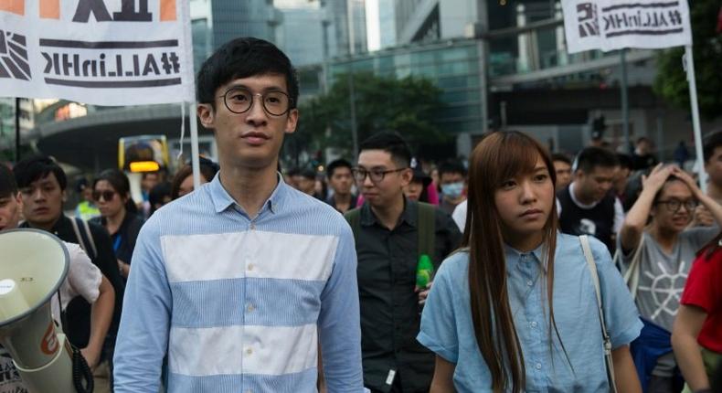 Baggio Leung (L) and Yau Wai-ching of the Youngspirations organisation march during a protest in Hong Kong, on November 6, 2016