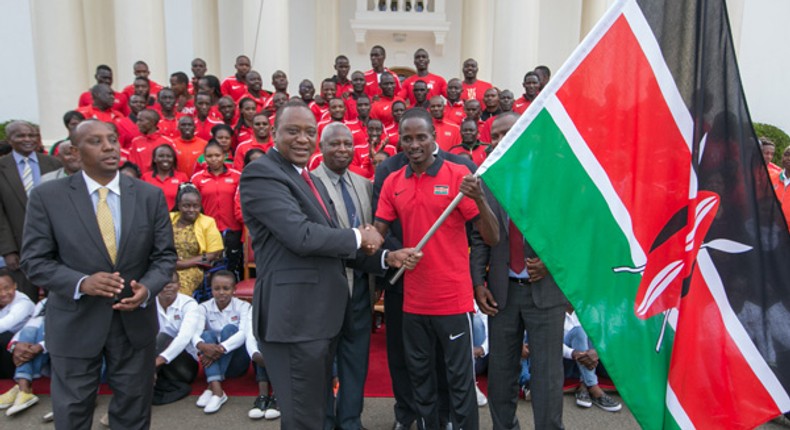 President Uhuru Kenyatta hands over flag to team that represented Kenya in the Commonwealth Games. 1972 Munich Olympics gold medalist Robert Ouko dies at age 70 in his Ngong home