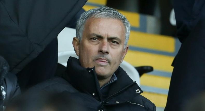 Manchester United's manager Jose Mourinho (C) sits in the stands on November 6, 2016