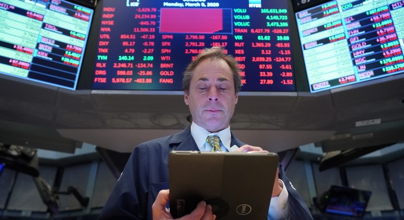 A trader works on the floor of the New York Stock Exchange (NYSE) in New York, U.S., March 9, 2020.
