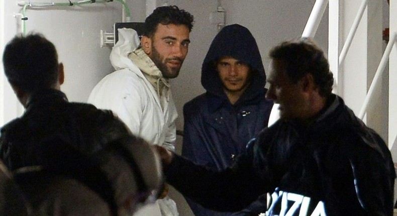 Mohammed Ali Malek (2nd L), one of the survivors and understood to be the captain of the boat that overturned off the coasts of Libya, seen onboard the Italian Coast Guard vessel Bruno Gregoretti, in April 2015