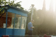 a guard flirts with a young girl on the entrance