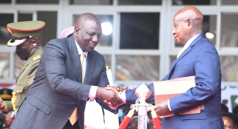 President William Ruto greets President Yoweri Museveni during the inuguration ceremony in Nairobi on September 13, 2022