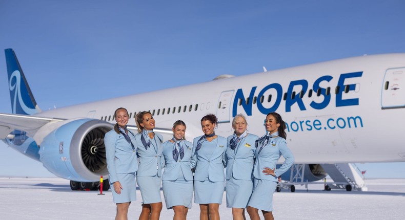 The cabin crew standing in front of the Norse plane in Antarctica, where the Boeing 787 landed — the first time for this particular model.Norse Atlantic Airways