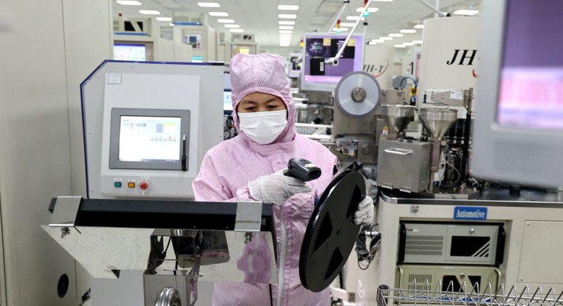 A woman works at a semiconductor plant in Yangxin county in east China's Shandong province.Feature China/Getty Images