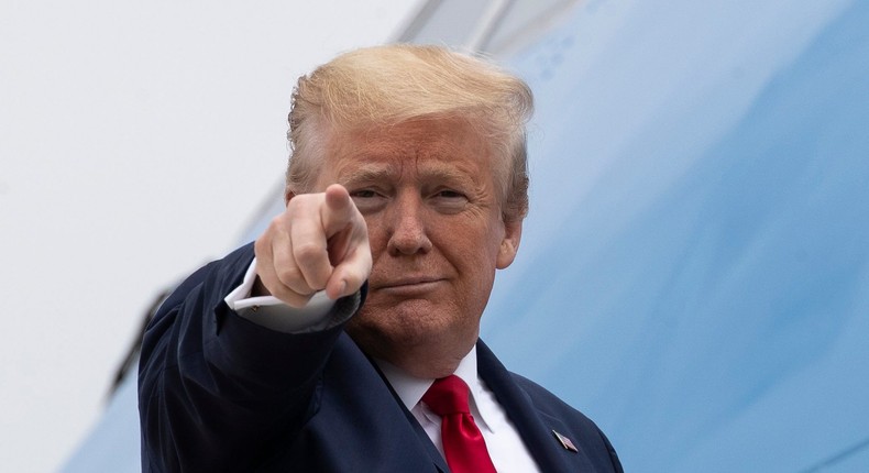 President Donald Trump points while boarding Air Force One as he departs Thursday, May 21, 2020, at Andrews Air Force Base, Md. Trump will visit a Ypsilanti, Mich., Ford plant that has been converted to making personal protection and medical equipment. (AP Photo/Alex Brandon)