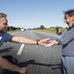 A Danish policeman plays with a migrant girl at the E45 freeway north of Padborg