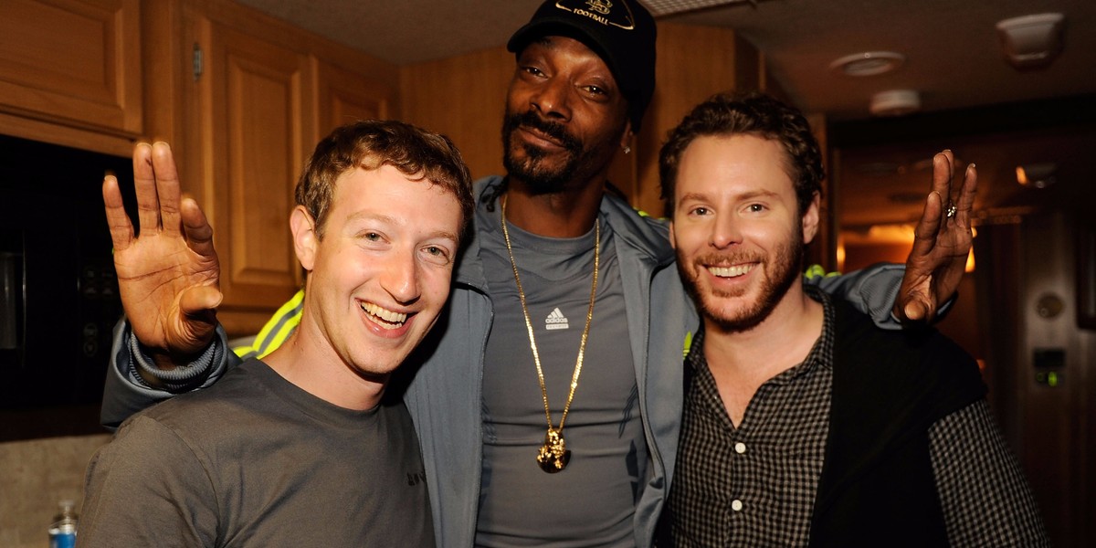 Sean Parker stands alongside Facebook founder Mark Zuckerberg and rapper Snoop Dogg at an event in 2011.