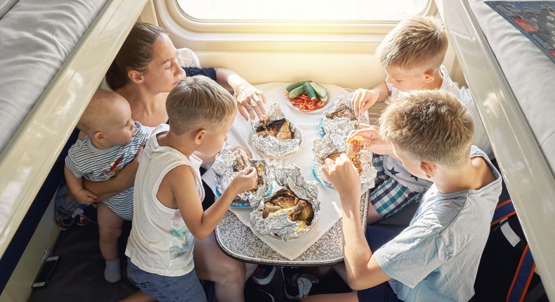 A family of four eating their meals.timltv/Getty Images