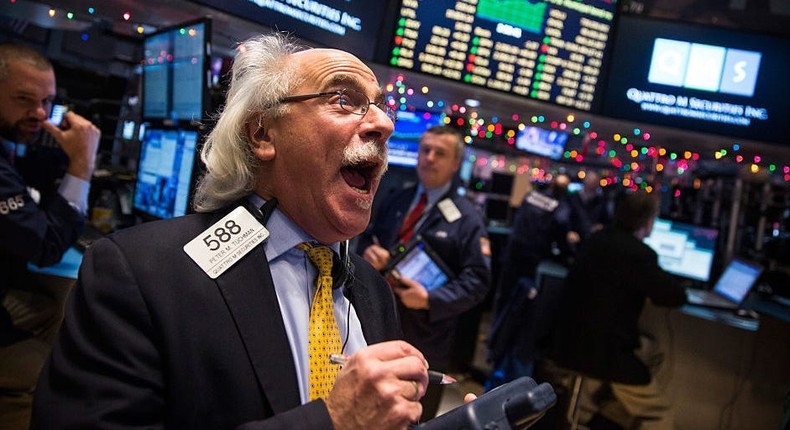 Traders work on the floor of the New York Stock Exchange