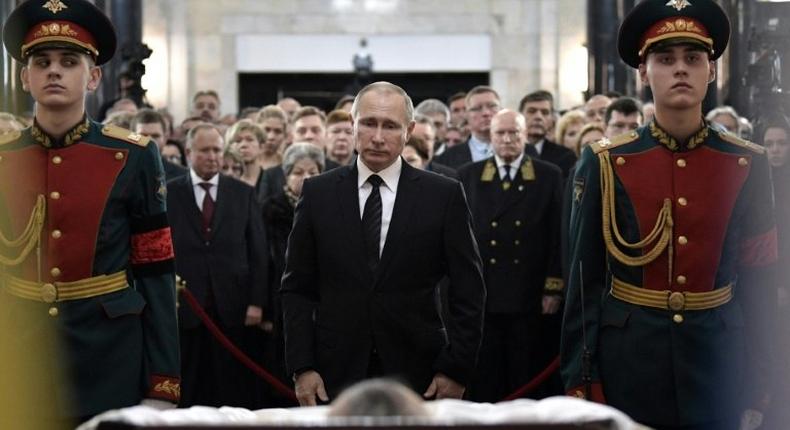 Russian President Vladimir Putin pays his respects to slain ambassador to Turkey Andrei Karlov during his funeral in Moscow on December 22, 2016