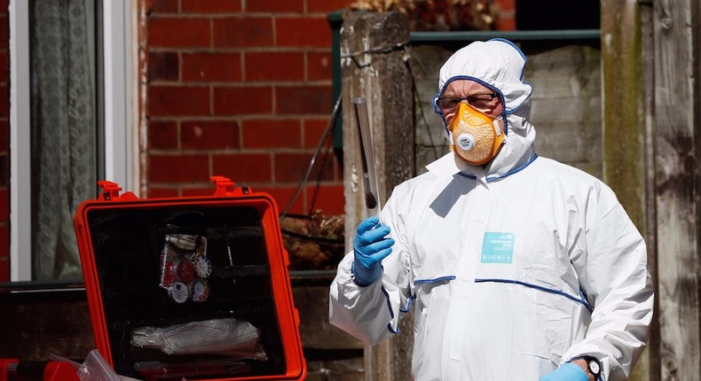 Police investigators work at residential property in south Manchester, Britain May 23, 2017.