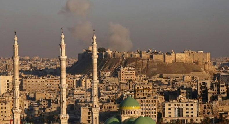 Smoke billows near Aleppo's historic citadel during fighting between Syrian regime forces and rebel fighters, on December 3, 2016