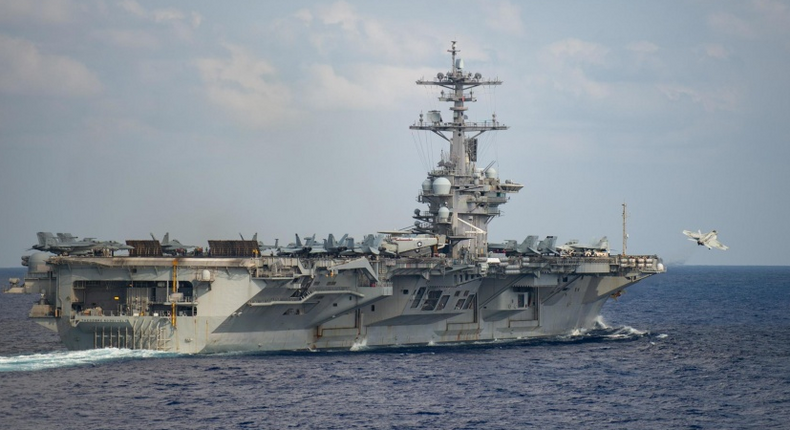 An F/A-18F Super Hornet, assigned to the Black Knights of Strike Fighter Squadron (VFA) 154, launches from the flight deck of the aircraft carrier USS Theodore Roosevelt (CVN 71) March 18, 2020.