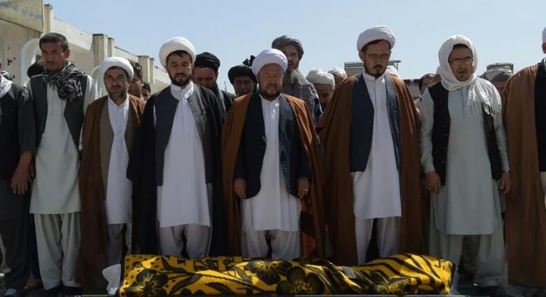 Distraught relatives and friends carried coffins into the cemetery one by one, a day after the latest deadly attack claimed by the Islamic State group on Afghanistan's reeling minority Shiite community