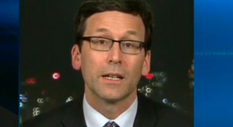 Washington State Attorney General Bob Ferguson (right) speaks on CNN about a federal judge's ruling that placed a temporary hold on President Donald Trump's immigration order.