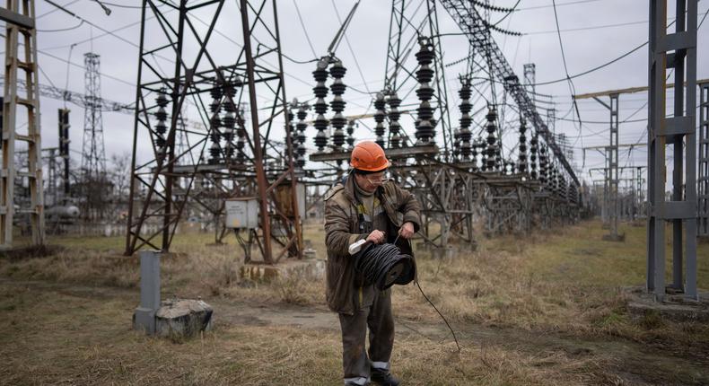 A worker at a power plant after a Russian attack in central Ukraine in January 2023.Evgeniy Maloletka/ AP