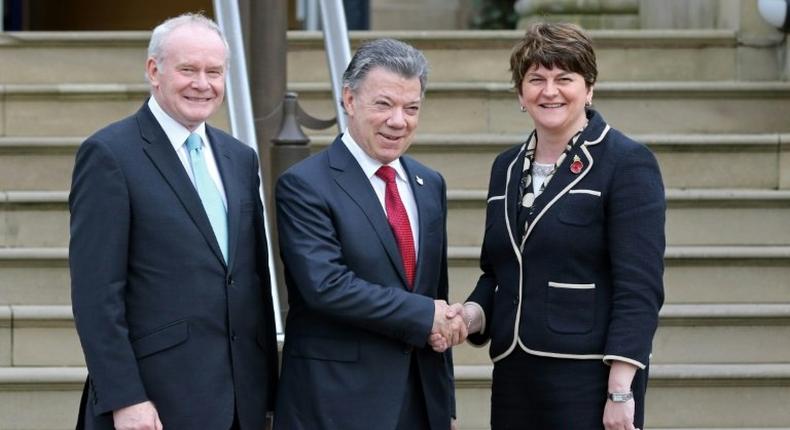 Colombian President Juan Manuel Santos (C) poses for a photograph with Northern Irish First Minister Arlene Foster (R) and Northern Irish deputy First Minister Martin McGuinness (L) as he arrives at Stormont Castle in Belfast on November 3, 2016