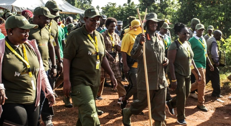 Ugandan President Yoweri Museveni and veterans and Members of Parliament, march through the jungle as he retraces the route which his guerrilla forces took 35 years ago