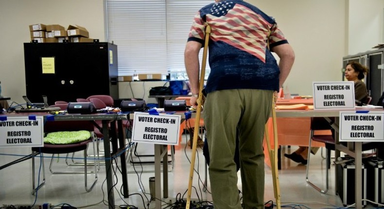 A man checks-in at the Activity Center at Bohrer Park during early voting on October 28, 2016 in Gaithersburg, Maryland