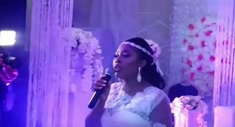 The singer doing what she loves doing at her wedding ceremony