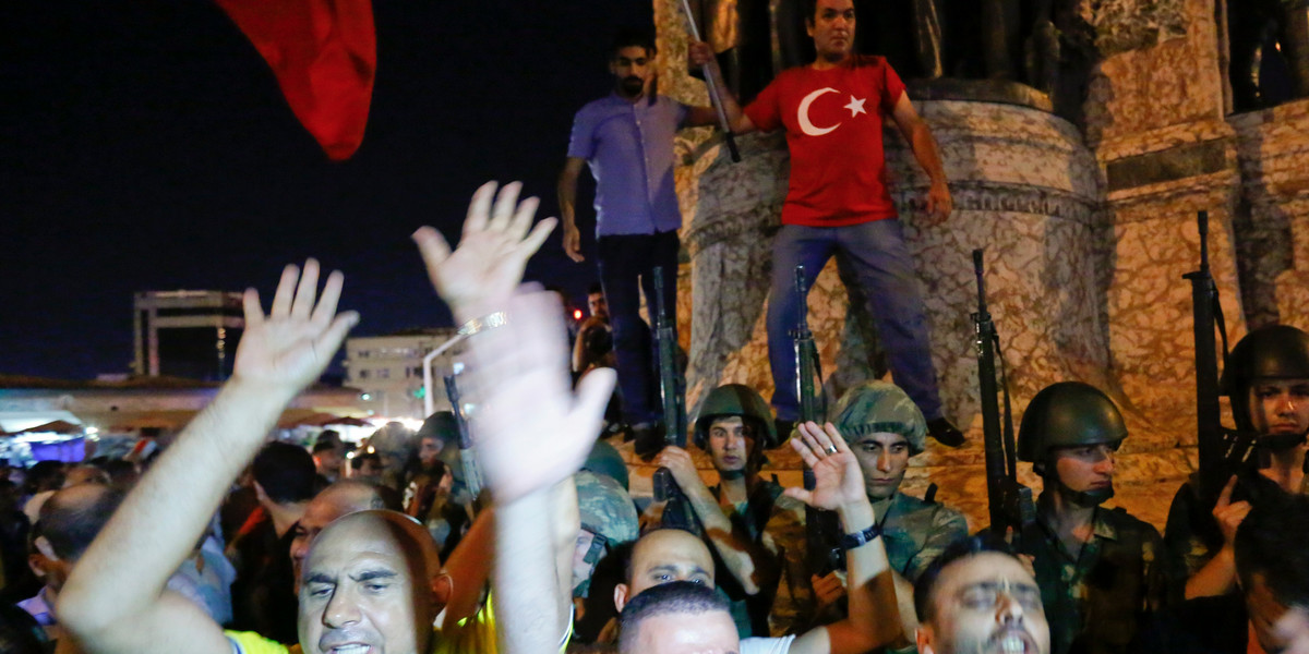 People demonstrate in front of the Republic Monument at Taksim Square in Istanbul on July 16.