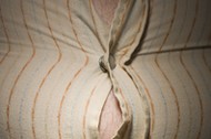 Close-up of fat stomach bursting through shirt