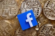 FILE PHOTO: Facebook logo is seen on representations of Bitcoin virtual currency in this illustration picture