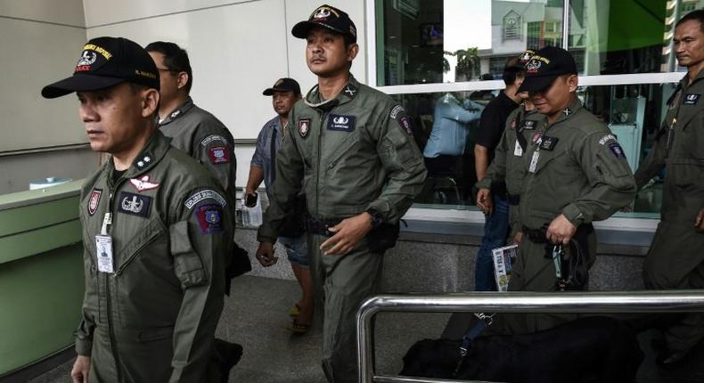 A Thai police forensics team leaves a Bangkok hospital that was struck by a small bomb on May 22, 2017