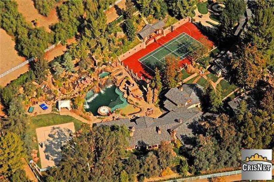 This aerial shot gives you a sense of the enormous size of the house ... and especially of that pool.