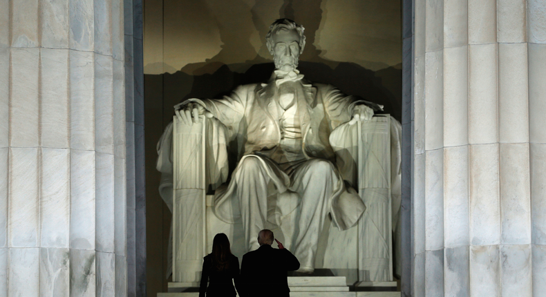 US President-elect Donald Trump saluted the statue of Abraham Lincoln as he and his wife, Melania, took part in a welcome concert in Washington.