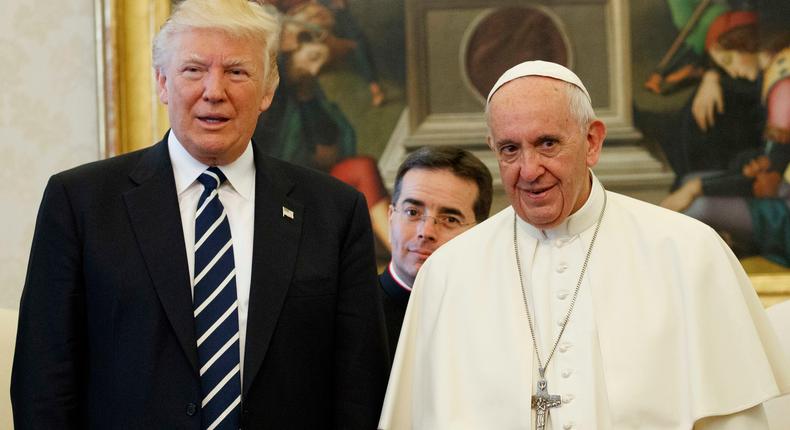 U.S. President Donald Trump stands with Pope Francis during a meeting, Wednesday, May 24, 2017, at the Vatican.