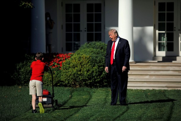 U.S. President Donald Trump welcomes 11-years-old Frank Giaccio as he cuts the Rose Garden grass at 