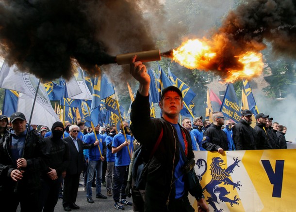 Members of the Ukrainian national guard Azov regiment and activists of the Azov civil corp take pa