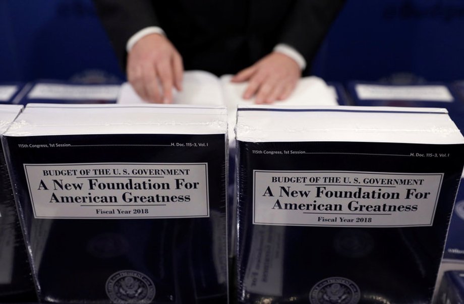 Copies of the budget are distributed on Capitol Hill in Washington