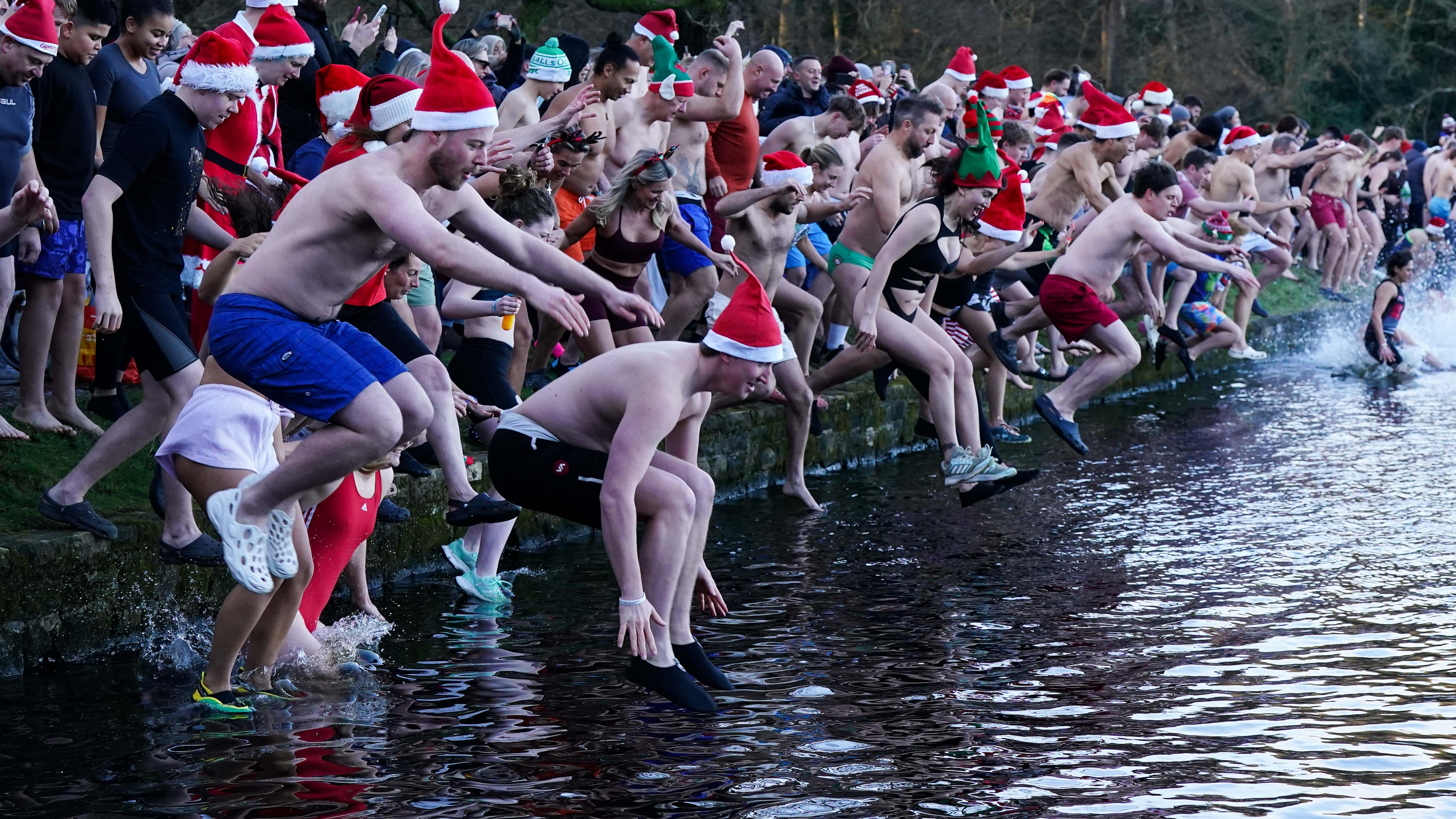 Hardy swimmers brave freezing waters across UK on Christmas Day