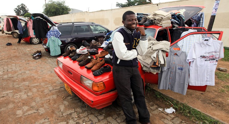 A man selling clothes from his car in Zimbabwe